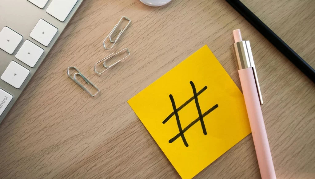 a sticky note with a hashtag drawn on it.