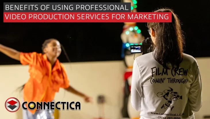 camerawoman filming child at a night event