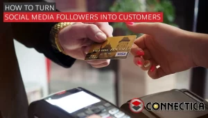 customer hands cashier their credit card