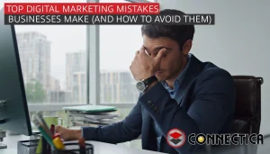 man covers his face infront of computer