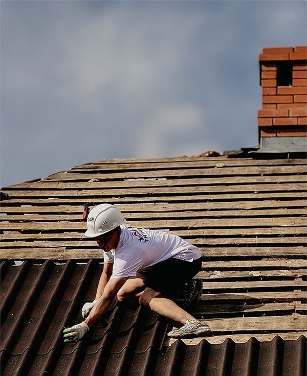 one guy working on roof